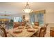 Spacious dining area with a view into the living room at 6047 E Peppertree Way # 224, Sarasota, FL 34242