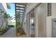 Inviting entryway with brick path and exterior staircase at 6047 E Peppertree Way # 224, Sarasota, FL 34242