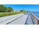 Serene waterfront pier with multiple benches at 6047 E Peppertree Way # 224, Sarasota, FL 34242
