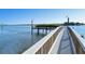 Wooden fishing pier extending over calm waters at 6047 E Peppertree Way # 224, Sarasota, FL 34242