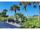 Outdoor grilling area with multiple grills and ample seating near the beach at 6047 E Peppertree Way # 224, Sarasota, FL 34242