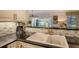 Kitchen with a double sink and water views at 6047 E Peppertree Way # 224, Sarasota, FL 34242