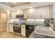 Modern kitchen with stainless steel appliances and granite countertops at 6047 E Peppertree Way # 224, Sarasota, FL 34242