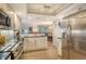 Updated kitchen featuring stainless steel appliances and breakfast bar at 6047 E Peppertree Way # 224, Sarasota, FL 34242
