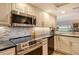 Modern kitchen with stainless steel appliances and stylish backsplash at 6047 E Peppertree Way # 224, Sarasota, FL 34242