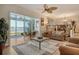 Spacious living room with water views and comfortable furniture at 6047 E Peppertree Way # 224, Sarasota, FL 34242