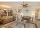 Living room with comfortable seating and water views at 6047 E Peppertree Way # 224, Sarasota, FL 34242