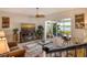 Living room with access to a relaxing patio and water views at 6047 E Peppertree Way # 224, Sarasota, FL 34242