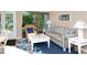 Bright living room with comfy sofa and coastal decor at 6047 E Peppertree Way # 224, Sarasota, FL 34242