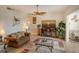 Cozy living room featuring a fireplace and water views at 6047 E Peppertree Way # 224, Sarasota, FL 34242