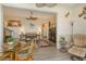 Open concept living room and dining area with water views at 6047 E Peppertree Way # 224, Sarasota, FL 34242