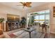 Living room features fireplace, water views, and open floor plan at 6047 E Peppertree Way # 224, Sarasota, FL 34242