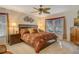 Comfortable main bedroom with a king-size bed and ample natural light at 6047 E Peppertree Way # 224, Sarasota, FL 34242
