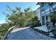 Private patio access with tranquil landscaping and water views at 6047 E Peppertree Way # 224, Sarasota, FL 34242