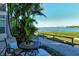 Relaxing patio with table, chairs, and waterfront views at 6047 E Peppertree Way # 224, Sarasota, FL 34242