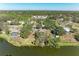 Aerial view of homes near a lake at 6300 26Th E Ave, Bradenton, FL 34208