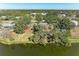 Aerial view showcasing a lakefront property and neighborhood at 6300 26Th E Ave, Bradenton, FL 34208