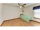Small bedroom featuring wood floors and a ceiling fan at 6300 26Th E Ave, Bradenton, FL 34208