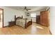 Bedroom with wood floors, ceiling fan, and wood furniture at 6300 26Th E Ave, Bradenton, FL 34208