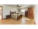 Bright bedroom with wood floors, ceiling fan, and dresser at 6300 26Th E Ave, Bradenton, FL 34208