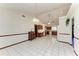 Open dining room with view of kitchen and access to patio at 6300 26Th E Ave, Bradenton, FL 34208