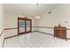 Dining room with tile floors, chandelier, and wood accents at 6300 26Th E Ave, Bradenton, FL 34208