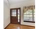 Entryway with hardwood floors and view of backyard at 6300 26Th E Ave, Bradenton, FL 34208