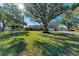 Brick ranch home with a large front yard and mature trees at 6300 26Th E Ave, Bradenton, FL 34208