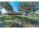 Brick ranch home with mature trees and spacious lawn at 6300 26Th E Ave, Bradenton, FL 34208