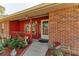 Inviting front door entry with landscaped walkway at 6300 26Th E Ave, Bradenton, FL 34208
