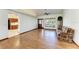 Living room with hardwood floors and kitchen view at 6300 26Th E Ave, Bradenton, FL 34208