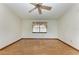 Empty living room with hardwood floors and large windows at 6300 26Th E Ave, Bradenton, FL 34208