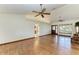 Living room with hardwood floors, high ceilings and two ceiling fans at 6300 26Th E Ave, Bradenton, FL 34208