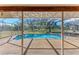 Inviting kidney-shaped pool with screened enclosure at 6300 26Th E Ave, Bradenton, FL 34208