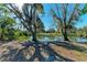 Serene waterfront property with mature trees at 6300 26Th E Ave, Bradenton, FL 34208
