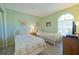 Guest bedroom with twin beds and light green walls at 6304 Pointe West Blvd # A306, Bradenton, FL 34209