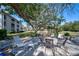 Community patio area with seating near a lake at 6304 Pointe West Blvd # A306, Bradenton, FL 34209
