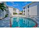 Refreshing community pool with brick coping and surrounding patio at 6304 Pointe West Blvd # A306, Bradenton, FL 34209