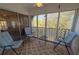 Relaxing sunroom with chairs and patio furniture at 6304 Pointe West Blvd # A306, Bradenton, FL 34209
