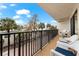 Spacious balcony with white chairs and ocean view at 6326 Midnight Pass Rd # 101, Sarasota, FL 34242