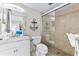 Clean bathroom with shower, toilet and granite countertop at 6326 Midnight Pass Rd # 101, Sarasota, FL 34242