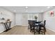 Casual dining area with table and chairs near entryway at 6326 Midnight Pass Rd # 101, Sarasota, FL 34242
