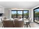 Spacious dining area with glass top table and view at 6326 Midnight Pass Rd # 101, Sarasota, FL 34242