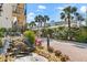 Community entrance with waterfall and landscaping at 6326 Midnight Pass Rd # 101, Sarasota, FL 34242