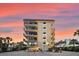 Four-story building with parking and sunset view at 6326 Midnight Pass Rd # 101, Sarasota, FL 34242