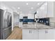 Modern kitchen with stainless steel appliances and granite countertops at 6326 Midnight Pass Rd # 101, Sarasota, FL 34242