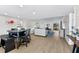 Bright and airy living room with comfortable seating and hardwood floors at 6326 Midnight Pass Rd # 101, Sarasota, FL 34242