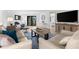 Living room with comfortable sofas, a coffee table, and large TV at 6326 Midnight Pass Rd # 101, Sarasota, FL 34242