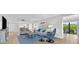 Open living room with balcony access and ample natural light at 6326 Midnight Pass Rd # 101, Sarasota, FL 34242