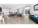 Open living space featuring light flooring and balcony access at 6326 Midnight Pass Rd # 101, Sarasota, FL 34242